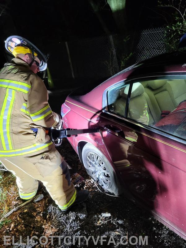 Firefighters practice using hydraulic spreaders to gain access to vehicles to extract patients. 