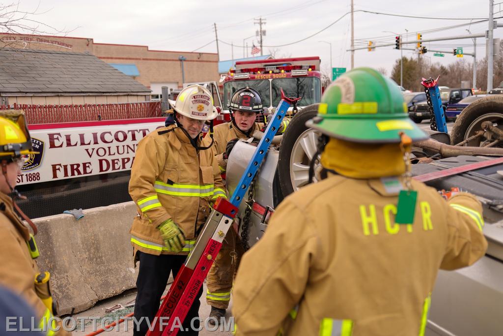 Firefighters practice vehicle stabilization and extricating patients.