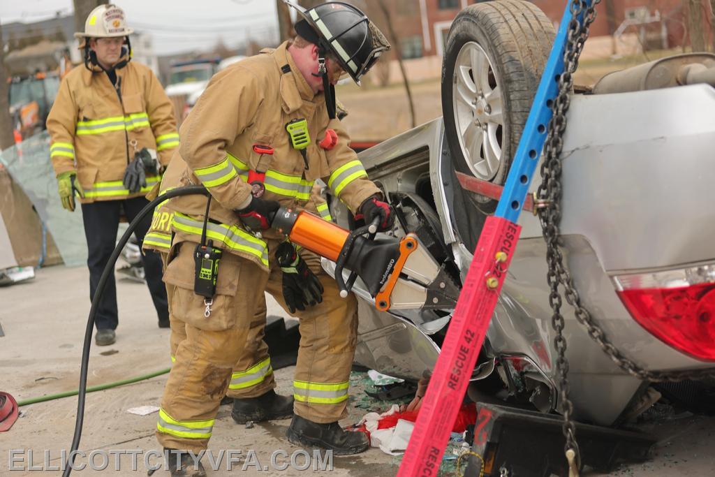 Firefighters practice vehicle stabilization and extricating patients.