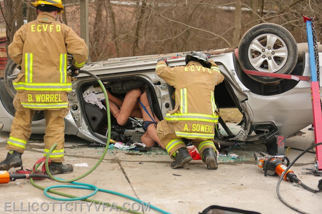 Firefighters practice vehicle stabilization and extricating patients.